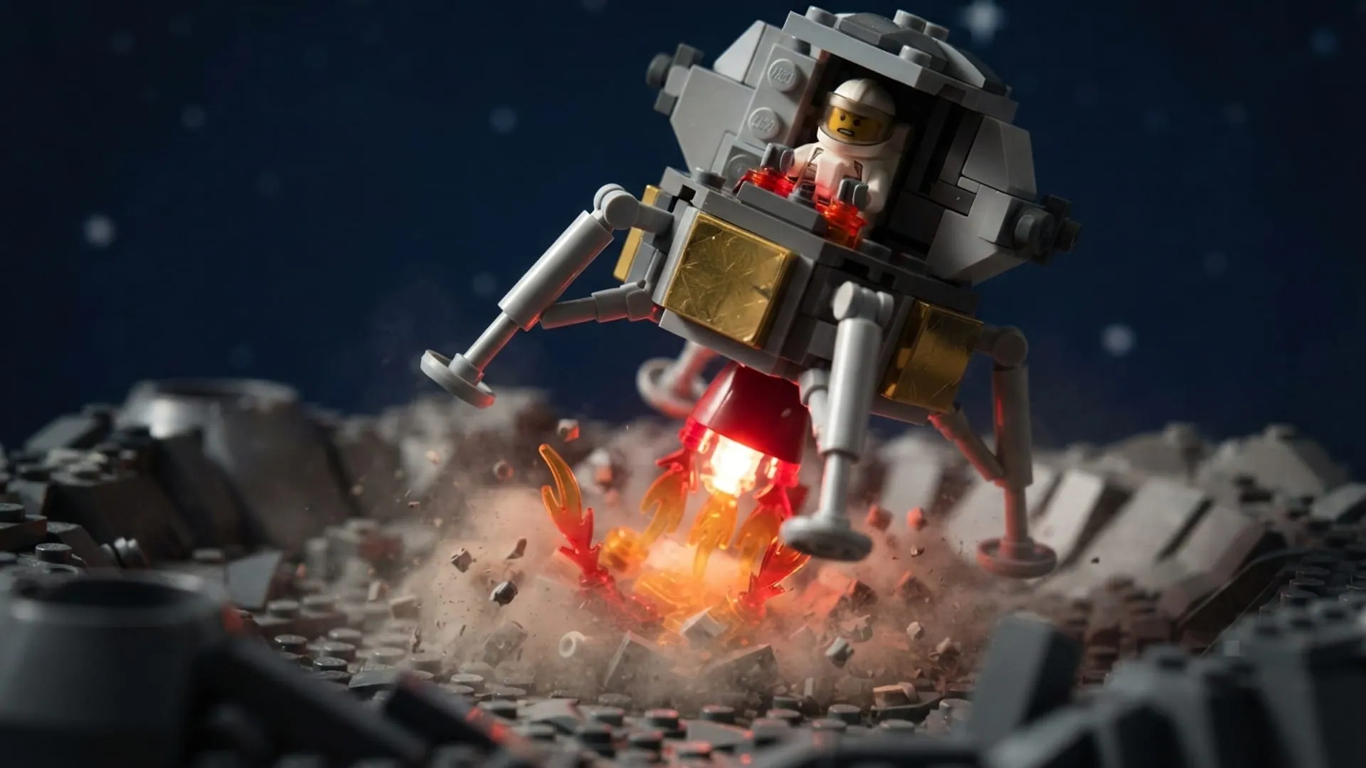 A toy-brick lunar lander firing its engine as it touches down on a rocky moon surface.