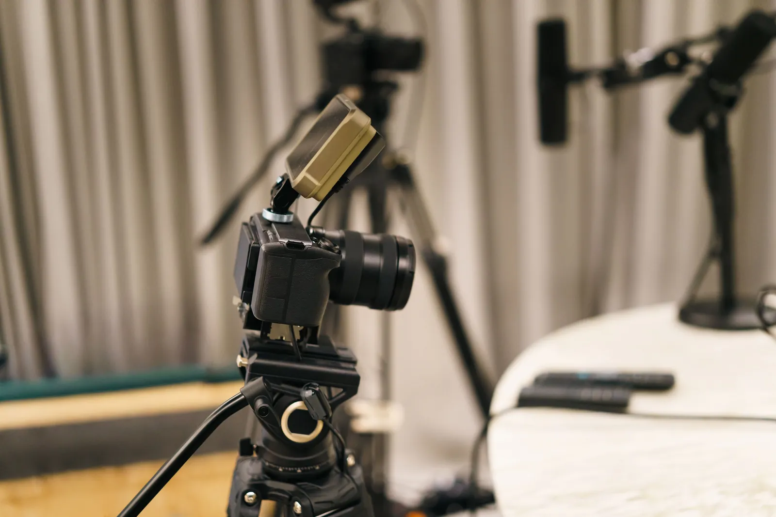 Close-up of a camera and microphone in a professional podcast studio
