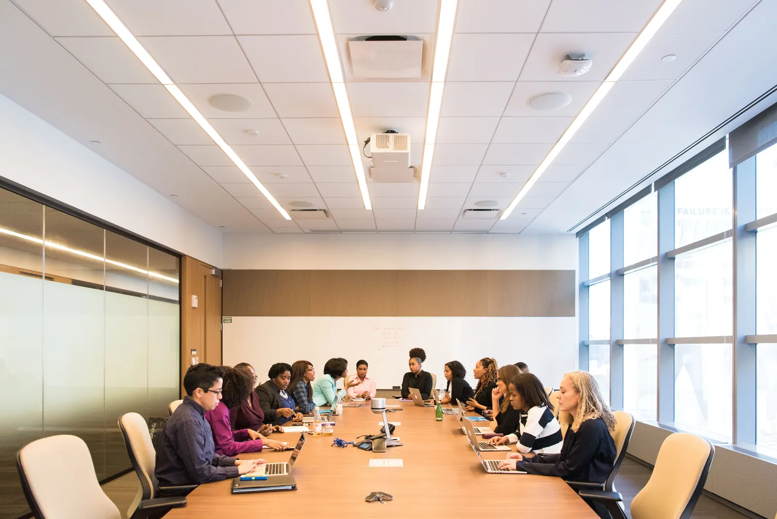 A multicultural team brainstorming and collaborating during a business meeting