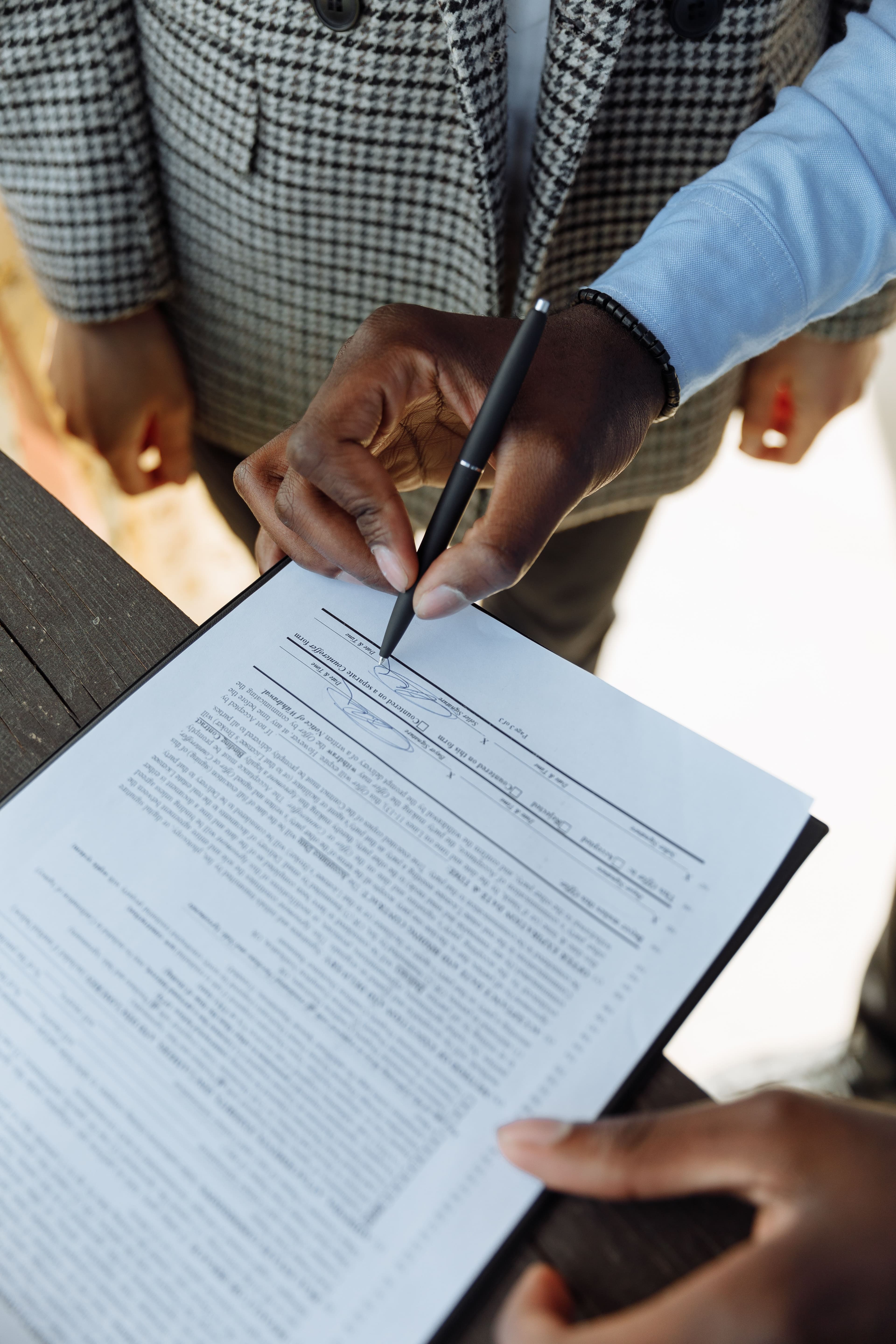 A person signing a document, representing a recorded consent decision